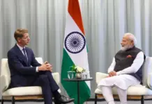 India, Maersk Discuss Deepening Indian Maritime Investment Emmanuel Macron and Narendra Modi sit in chairs for a bilateral meeting, with the Indian flag between them.