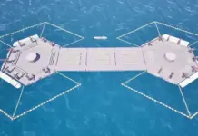 Jiangnan Shipyard Proposes Nuclear Floating Logistics Hub A modular floating dock with two octagonal deck sections connected by a central walkway over blue water.