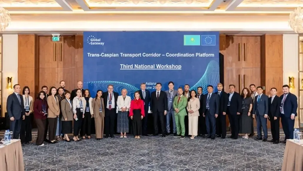 Group of delegates posing for a photo at the Third National Workshop of the Trans-Caspian Transport Corridor – Coordination Platform, Astana.